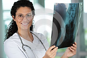 smiling female doctor with mri in hospital