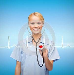 Smiling female doctor or nurse with stethoscope