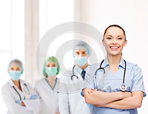 Smiling female doctor or nurse with stethoscope