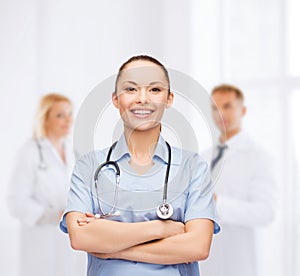 Smiling female doctor or nurse with stethoscope