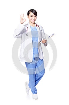 Smiling female doctor with okay gesture photo