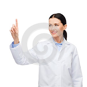 Smiling female doctor pointing to something
