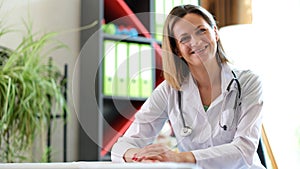 Smiling female doctor posing in clinic office