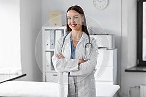 smiling female doctor with stethoscope at hospital