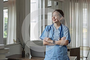 Smiling female doctor wearing a stethoscope in the doctor& x27;s office in the hospital