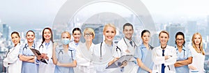 Smiling female doctors and nurses with stethoscope