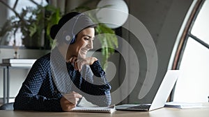 Smiling female employee talk on video call on computer