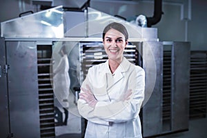 Smiling female engineer in front of Food Dryer Dehydrator Machine