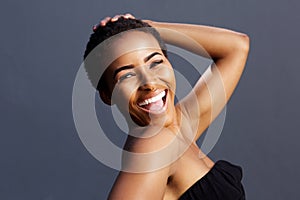 Smiling female fashion model with hand in hair