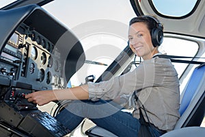 Smiling female helicopter pilot