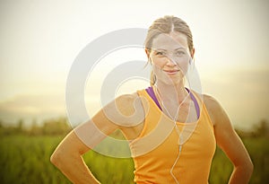 Smiling Female Jogger at Sunset