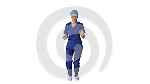 Smiling female medical doctor in blue uniform dancing and cheering on white background.