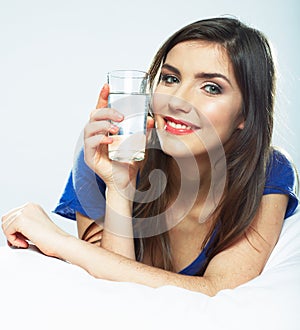 Smiling female model portrait with water glass.