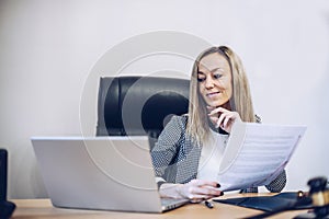 Smiling female notary working in her office