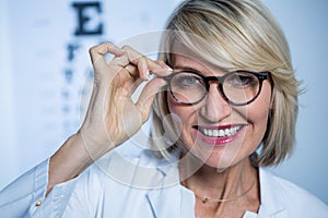 Smiling female optometrist wearing spectacles