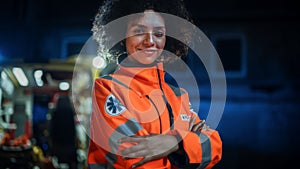 Smiling Female Paramedic Looking at Camera and Posing with Crossed Hands. A Strong Multiethnic