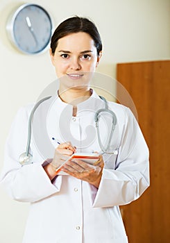 Smiling female physician indoors