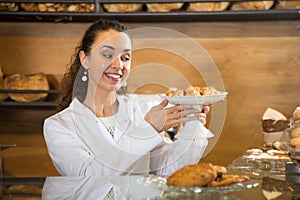 Smiling female selling tarts