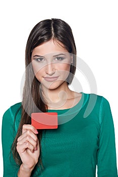 Smiling female showing blank credit card