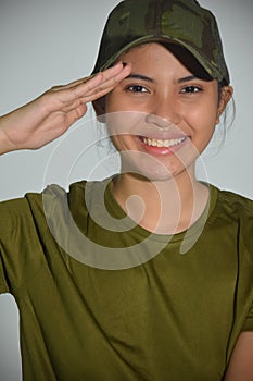 A Smiling Female Soldier Saluting