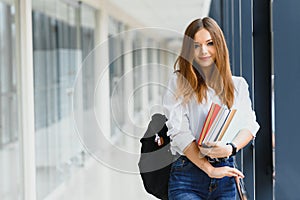 Smiling female student enhancing her future by attending regular lectures photo
