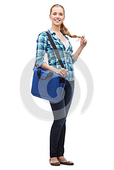 Smiling female student with laptop bag