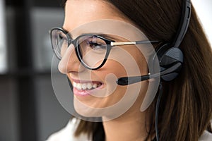 Smiling female support operator in headset