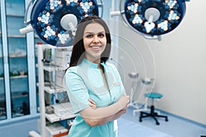 Smiling female surgeon in operating room