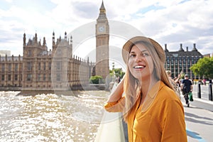 Smiling female tourist visiting London sights, United Kingdom