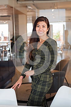 Smiling female worker in modern office