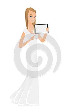 Smiling fiancee holding tablet computer.