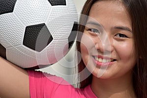 Smiling Fitness Diverse Female Athlete With Soccer Ball