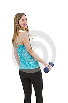 Smiling fitness woman with dumbbell