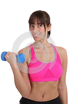 Smiling fitness woman at sports workout training with dumbbell i