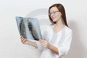 Smiling focused doctor woman with X-ray of lungs, fluorography, roentgen isolated on white background. Female doctor in