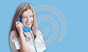 Smiling and friendly medical doctor with telephone