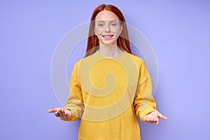 smiling friendly red-haired woman standing with open arms