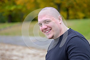 Smiling friendly thickset young man photo