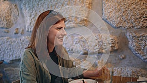 Smiling friends chatting coffeehouse under lamp light close up. Friendly girls