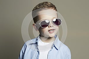Smiling Funny child.fashionable little boy in sunglasses