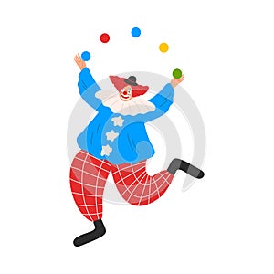 Smiling funny clown in costume juggling with colorful balls during performance in circus