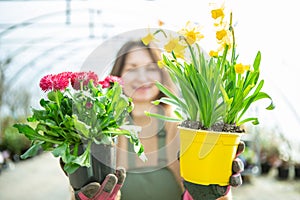 Smiling Gardener Presenting Potted Flowers