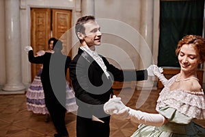 Smiling Gentleman Wearing Tailcoat Dancing with Lady