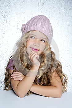 Smiling gesture little girl winter pink cap