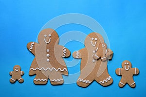 Smiling GingerBread People on Blue Background