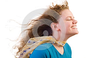 Smiling girl against the wind