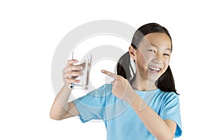 Smiling girl,Asian gril holding a glass of water isolated on white background,Life canÃ¢â¬â¢t live without drinking water. photo