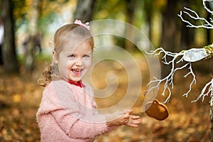 Smiling girl in the autumn park