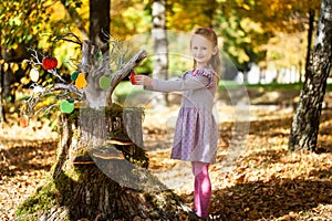 Smiling girl in the autumn park