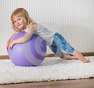 Smiling girl on the ball